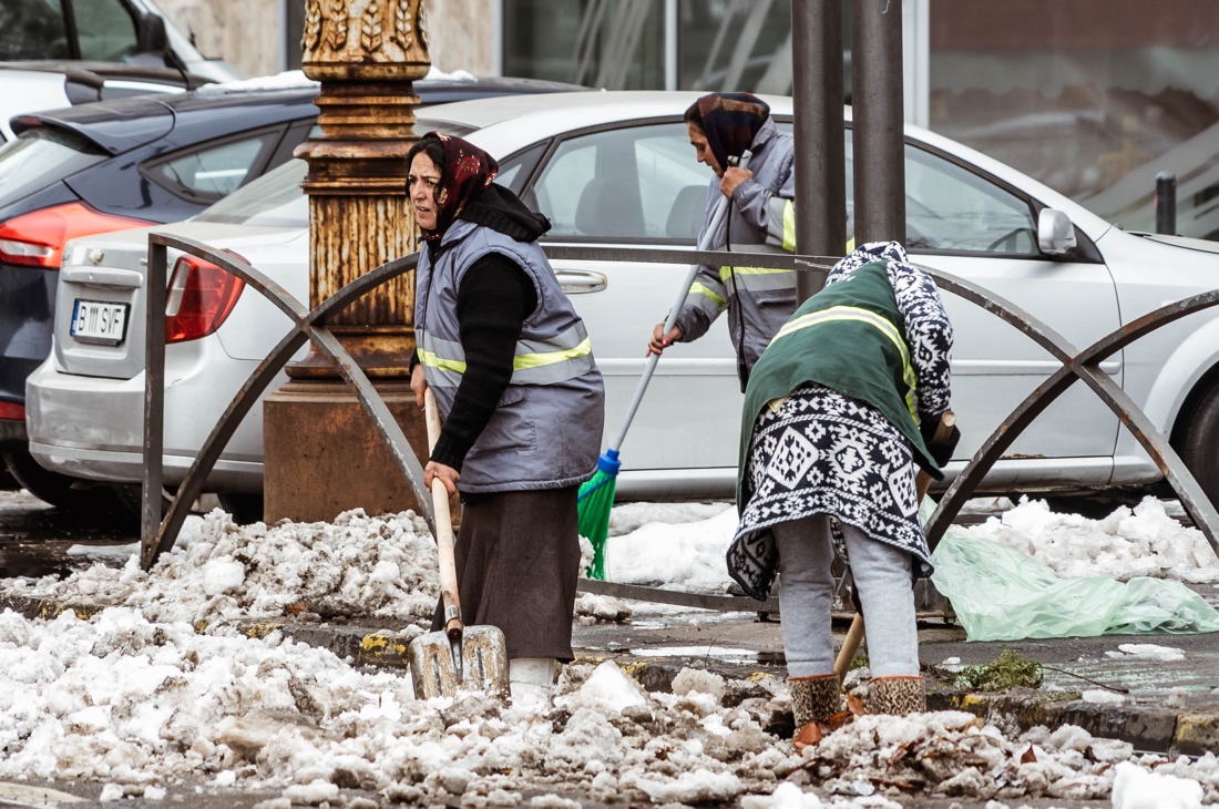 A few people shoveling snow

Description automatically generated with medium confidence